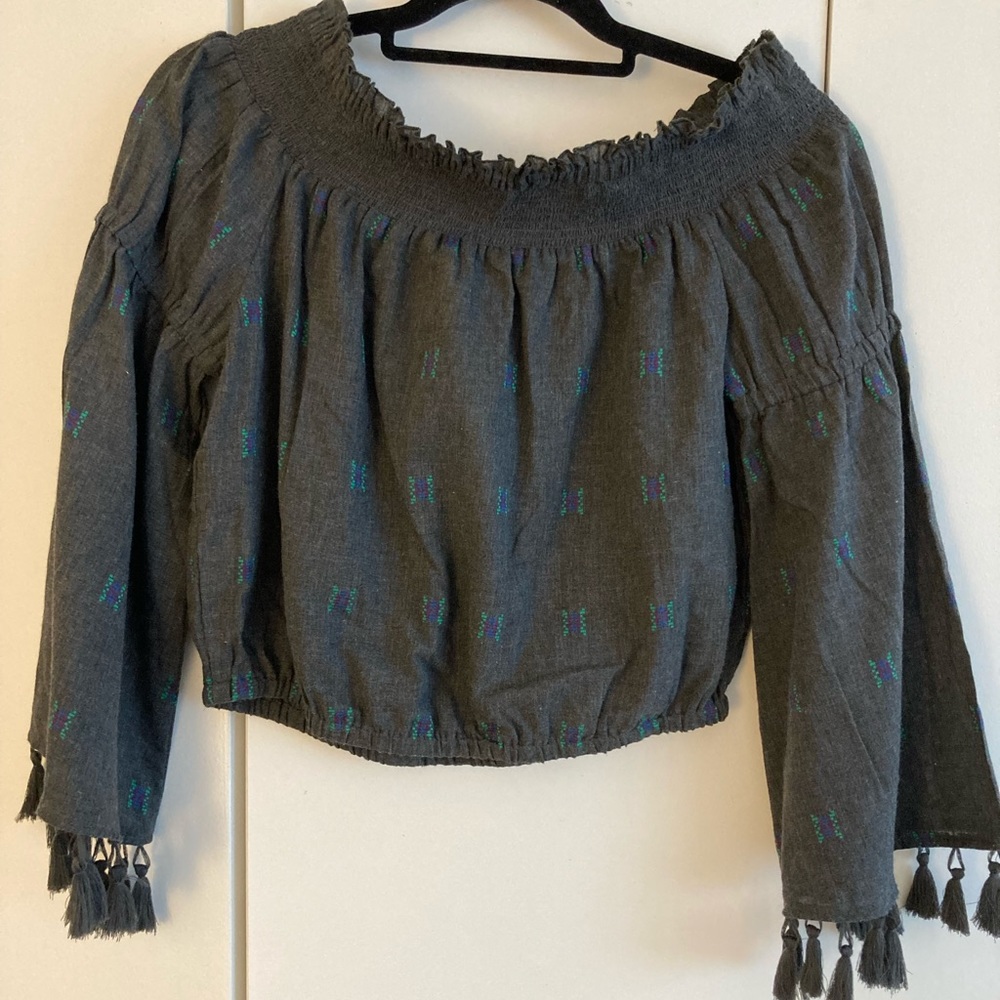 Earthbound Grey with tassel trim on sleeves top